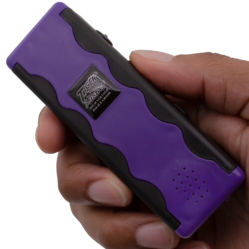 Revelator Stun Gun with Alarm purple in hand