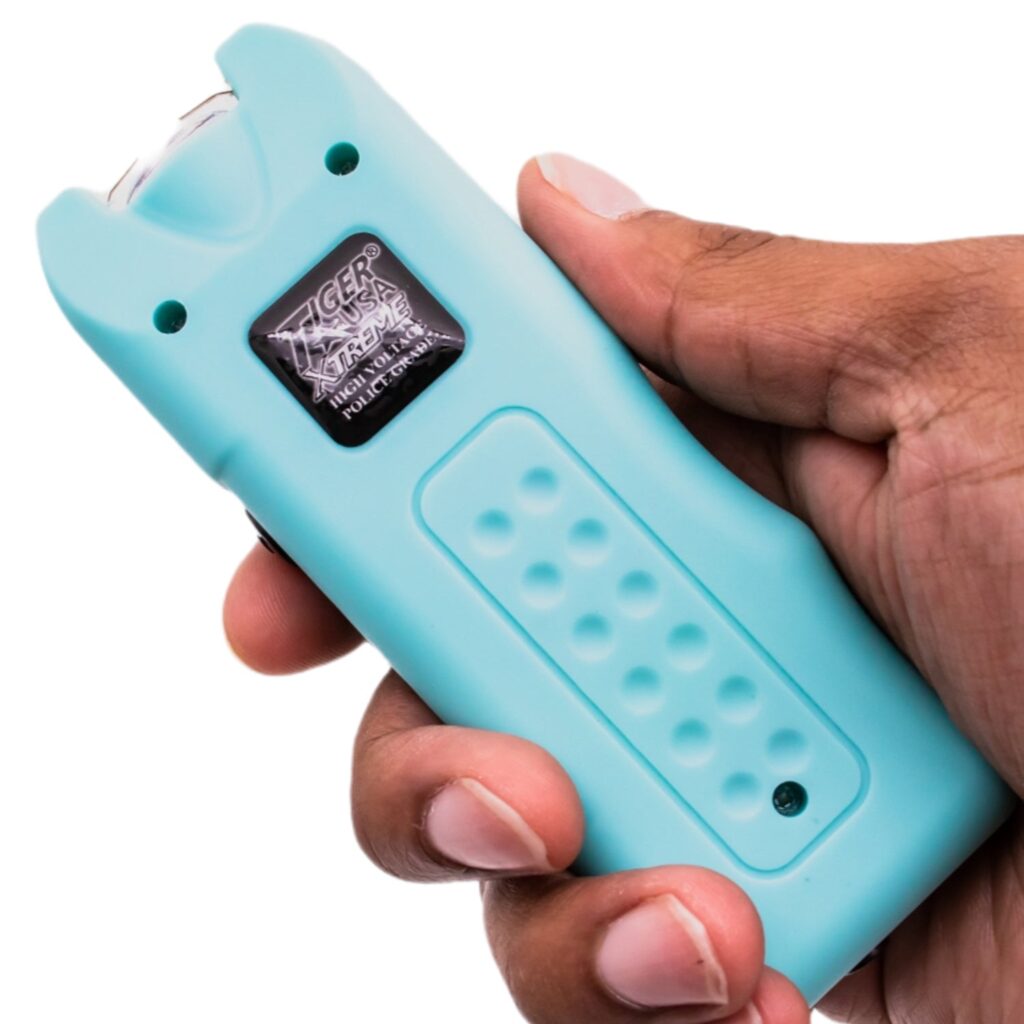 ThugBusters Origin Stun Gun Teal in hand