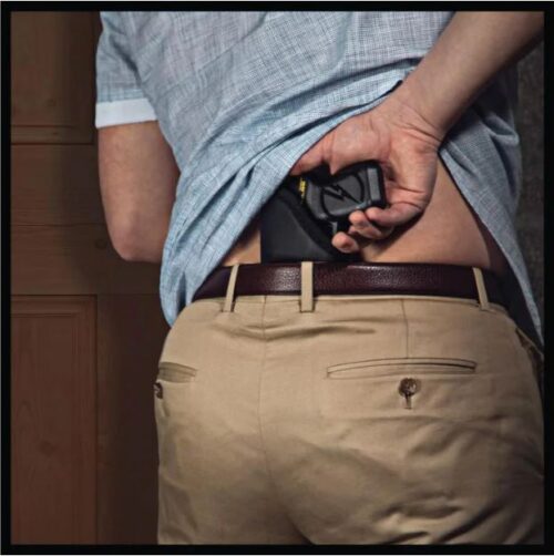 TASER Pulse sticky holster shown with TASER inserted back waistband