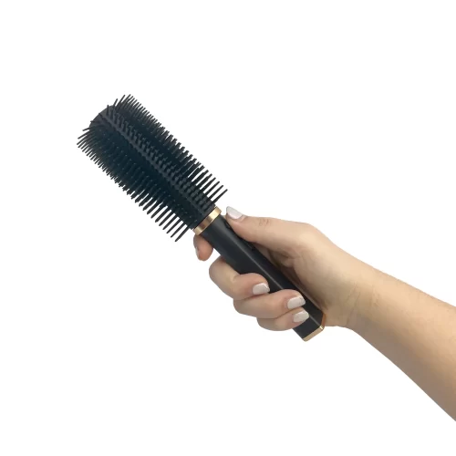 Hair Fryer Stun Gun as brush in hand